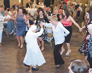 SPECIAL TO THE VINDICATOR
The Auxiliary of the Oblate Sisters of the Sacred Heart of Jesus is hosting its second annual Bella Sera “Beautiful Evening” event which will support the ministries of the Oblate Sisters. The event will take place from 6 to 11 p.m. June 4 at the social hall of Our Lady of Mount Carmel Basilica, 343 Via Mount Carmel Ave., Youngstown. The authentic Italian evening will feature the Sisters’ famous lasagna and cookie table with Italian sweets. Dancing will be to the music of Franco Simone. There will be raffle baskets and a grand prize of $1,000. Tickets are $50 per person or $95 per couple with a full cash bar, and raffle tickets are $10 each. Both are available now at the convent office or call Sister Karen Marie at 330-759-9239 or 330-717-3109. No tickets will be sold at the door. At left are Sister Teresina Rosa and Carmel DiFelice dancing at the event last year.
