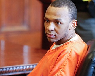   ROBERT K YOSAY | THE VINDICATOR..Austin  sits and stares as family gives vicitm statements ..Sentencing of Michael Austin and Hakeem Henderson.The Honorable Judge John DurkinÕs courtroom, Mahoning County Common Pleas Cour.Austin was convicted of four counts of murder; Henderson was convicted of two counts of murder... .--30-