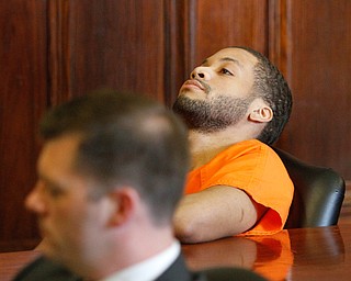   ROBERT K YOSAY | THE VINDICATOR..Hakeem stares at the ceiling - as Austin - is in front of the  judge..Sentencing of Michael Austin and Hakeem Henderson.The Honorable Judge John DurkinÕs courtroom, Mahoning County Common Pleas Cour.Austin was convicted of four counts of murder; Henderson was convicted of two counts of murder... .--30-