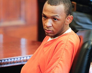   ROBERT K YOSAY | THE VINDICATOR..Michael Austin stares at the victims statements are read..Sentencing of Michael Austin and Hakeem Henderson.The Honorable Judge John DurkinÕs courtroom, Mahoning County Common Pleas Cour.Austin was convicted of four counts of murder; Henderson was convicted of two counts of murder... .--30-