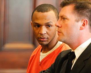   ROBERT K YOSAY | THE VINDICATOR..Michael Austin listens to his attorney... .Ed Hartwig ...atty.Sentencing of Michael Austin and Hakeem Henderson.The Honorable Judge John DurkinÕs courtroom, Mahoning County Common Pleas Cour.Austin was convicted of four counts of murder; Henderson was convicted of two counts of murder... .--30-