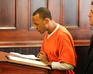   ROBERT K YOSAY | THE VINDICATOR..Michael Austin reads his statement ....... ..Sentencing of Michael Austin and Hakeem Henderson.The Honorable Judge John DurkinÕs courtroom, Mahoning County Common Pleas Cour.Austin was convicted of four counts of murder; Henderson was convicted of two counts of murder... .--30-