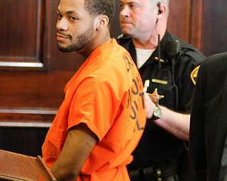   ROBERT K YOSAY | THE VINDICATOR..Hakeem smiles as he is lead away..Sentencing of Michael Austin and Hakeem Henderson.The Honorable Judge John DurkinÕs courtroom, Mahoning County Common Pleas Cour.Austin was convicted of four counts of murder; Henderson was convicted of two counts of murder... .--30-