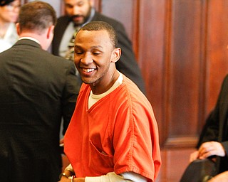   ROBERT K YOSAY | THE VINDICATOR..Austin smiles as he is led away...Sentencing of Michael Austin and Hakeem Henderson.The Honorable Judge John DurkinÕs courtroom, Mahoning County Common Pleas Cour.Austin was convicted of four counts of murder; Henderson was convicted of two counts of murder... .--30-