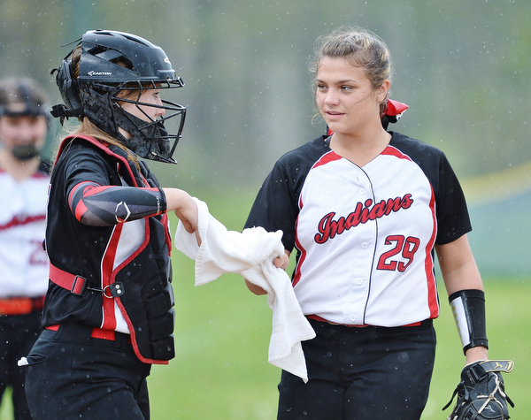 Jeff Lange | The Vindicator WED, MAY 11, 2016 - Girard pitcher Karlee Byrne (29) takes a towel to dry off the ball from catcher Hanna Jones early in Wednesday's game at Lakeview High School.