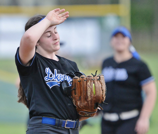 Jeff Lange | The Vindicator WED, MAY 11, 2016 - Lakeview's Cait Kelm wipes the sweat from her brow after Girard scored three runs in the sixth inning of Wednesday's game at Lakeview High School. The Bulldogs defeated Girard 4-3.