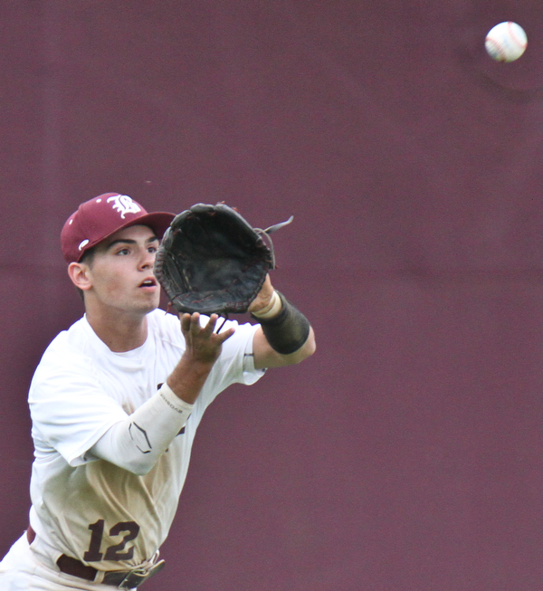 Williiam D Lewis the vindicator Boardman Luke Cardillo (120 catches a flyball during  win over Warren Harding at Boardman May 12-16.