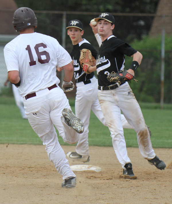 Williiam D Lewis the vindicator Boardman's Nick Stump(16) is out at 2nd as Warren's Doug Painter (2) tries to turn a double. Warren's Nicholas Fitzgerald is in background. During game at Boardman May 12-16.