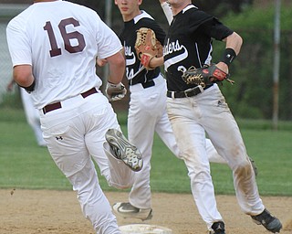 Williiam D Lewis the vindicator Boardman's Nick Stump(16) is out at 2nd as Warren's Doug Painter (2) tries to turn a double. Warren's Nicholas Fitzgerald is in background. During game at Boardman May 12-16.