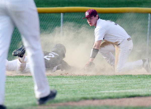 Williiam D Lewis the vindicator Boardman's Mike Melewski(5) looks up for the call after putting Harding's Doug Painter(2) out at 3rd to end the game at Boardman.