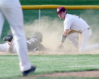 Williiam D Lewis the vindicator Boardman's Mike Melewski(5) looks up for the call after putting Harding's Doug Painter(2) out at 3rd to end the game at Boardman.