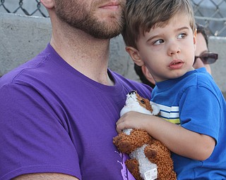William d Lewis The Vindicator Joshua Johnson, a 6 year cancer survivor from Boardman holds his son Jericho, 2, during Boardman Relay for Life 5-13-16