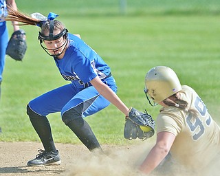 Jeff Lange | The Vindicator  FRI, MAY 13, 2016 - Jackson-Milton second baseman Maggie Garland (left) attempts to put the tag on Lowellville's Olivia Sotlar (99) as she slides into second in the second inning of Friday's game at Jackson-Milton High School.