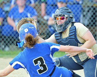 Jeff Lange | The Vindicator  FRI, MAY 13, 2016 - Lowellville catcher Olivia Sotlar (right) attempts to make a play at home as Blue Jay's baserunner Jordon Stratton (3) slides safely to the plate in the fourth inning of Friday's game at Jackson-Milton High School.