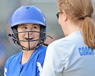 Jeff Lange | The Vindicator  FRI, MAY 13, 2016 - Jackson-Milton's Jenna Seka shares a moment of laughter with coach Kelly Snowden during a Lowellville timeout in the fourth inning of Friday's game at Jackson-Milton High School.