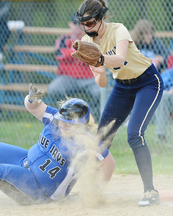 Jeff Lange | The Vindicator  FRI, MAY 13, 2016 - Blue Jays' Taylor Sahli (14) safely falls back onto first base as Lowellville first baseman Grace Soltar attempts to apply the tag in the fifth inning of Friday's game at Jackson-Milton High School.