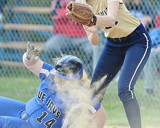 Jeff Lange | The Vindicator  FRI, MAY 13, 2016 - Blue Jays' Taylor Sahli (14) safely falls back onto first base as Lowellville first baseman Grace Soltar attempts to apply the tag in the fifth inning of Friday's game at Jackson-Milton High School.