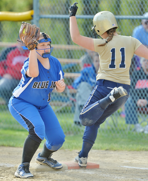 Jeff Lange | The Vindicator  FRI, MAY 13, 2016 - Blue Jays' first baseman Madde Hyland (left) makes a play at first as Lowellville's Jessica Johnston (11) steps on the bag in the sixth inning of Friday's game at Jackson-Milton High School.