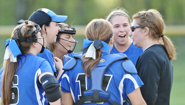 Jeff Lange | The Vindicator  FRI, MAY 13, 2016 - In the final moments of their game against Lowellville, members of the Blue Jays infield share a moment of laughter with coach Kelly Snowden Friday afternoon at Jackson-Milton High School. Jackson-Milton defeated Lowellville 8-1.
