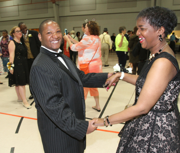 William D. Lewis The Vindicator Purple Cat clients Eric Higgs and Tiffany Gordon, both of Youngstown, dance during Purple Cat Prom held at St. Nick's Hall in Struthers 5-14-16.