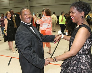 William D. Lewis The Vindicator Purple Cat clients Eric Higgs and Tiffany Gordon, both of Youngstown, dance during Purple Cat Prom held at St. Nick's Hall in Struthers 5-14-16.
