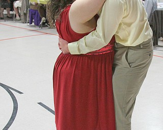 William D. Lewis The Vindicator Purple Cat clients Derrik Rex and Rana Payne dance during Purple Cat Prom held at St. Nick's Hall in Struthers 5-14-16.