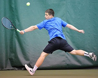 Jeff Lange | The Vindicator  SAT, MAY 14, 2016 - Lakeview's #1 seed Zack Teffner backhands the ball back over the net during a match against #2 seed Les Horvath of Ursuline Saturday morning at Boardman Tennis Center.