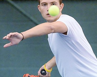 Jeff Lange | The Vindicator  SAT, MAY 14, 2016 - Mooney's Andrew Stille stares down the ball as he prepares to hit it back over the net during a doubles match with teammate Jacob Stefko against Poland's Sam Scotford and Sam Delatore Saturday morning at Boardman Tennis Center.