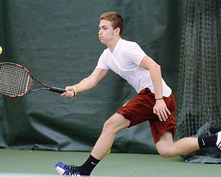 Jeff Lange | The Vindicator  SAT, MAY 14, 2016 - Mooney's Andrew Stille hits the ball back over the net during a doubles match with teammate Jacob Stefko against Poland's Sam Scotford and Sam Delatore Saturday morning at Boardman Tennis Center.