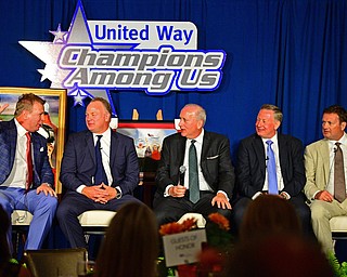 YOUNGSTOWN, OHIO - MAY 16, 2016: Mike Stoops tells a story on stage while sitting next to his brother Mark Stoops, Bob Hannon, Ron Stoops and Bob Stoops Monday evening during the Champions Among Us Banquet at the Lake Club. DAVID DERMER | THE VINDICATOR