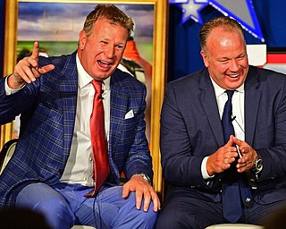 YOUNGSTOWN, OHIO - MAY 16, 2016: Mike Stoops tells a story on stage while sitting next to his brother Mark Stoops Monday evening during the Champions Among Us Banquet at the Lake Club. DAVID DERMER | THE VINDICATOR