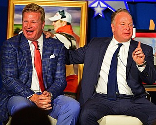 YOUNGSTOWN, OHIO - MAY 16, 2016: Mike Stoops (left) and Mark Stoops (right) laugh on stage while telling a story Monday evening during the Champions Among Us Banquet at the Lake Club. DAVID DERMER | THE VINDICATOR