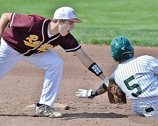 Jeff Lange | The Vindicator  MON, MAY 16, 2016 - South Range shortstop Brandon Youngs (left) puts the tag on Canton Central Catholic's Brady Thompson in the bottom of the first inning of Monday's district semifinal at Cene Park.