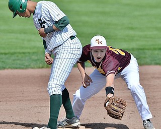 Jeff Lange | The Vindicator  MON, MAY 16, 2016 - Canton Central Catholic's JC Colangelo steps on the bag as South Range's Brandon Youngs misses the catch in the bottom of the third inning of their matchup in the district semifinal at Cene Park.