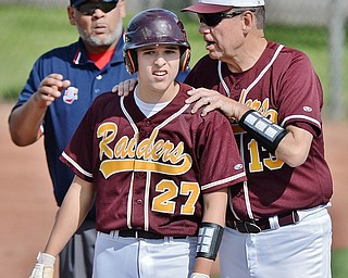 Jeff Lange | The Vindicator  MON, MAY 16, 2016 - South Range first base coach Don DeChellis gives instruction to Brandon Youngs in the fourth inning of Monday's district semifinal in Struthers.