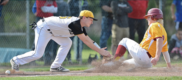 Jeff Lange | The Vindicator  MON, MAY 16, 2016 - With an empty glove, Crestview third baseman Kaden Davis attempts to tag out Mooney baserunner Bryce Richey as he slides safely into third base in the fourth inning of Monday's district semifinal at Cene Park.