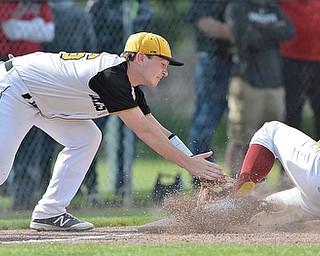 Jeff Lange | The Vindicator  MON, MAY 16, 2016 - With an empty glove, Crestview third baseman Kaden Davis attempts to tag out Mooney baserunner Bryce Richey as he slides safely into third base in the fourth inning of Monday's district semifinal at Cene Park.