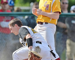 Jeff Lange | The Vindicator  MON, MAY 16, 2016 - Mooney's Bryce Richey (top) celebrates at third after sliding safely to the bag as Crestview third baseman Kaden Davis stands to his feet in the fourth inning of a district semifinal at Cene Park.