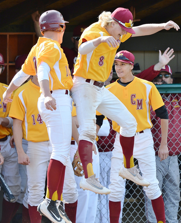 Jeff Lange | The Vindicator  MON, MAY 16, 2016 - Mooney's Dom Pecchia (left) and Bryce Richey celebrate after Pecchia scored a run in the fourth inning of Monday's district semifinal against Crestview at Cene Park.