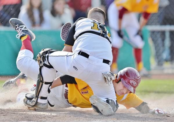 Jeff Lange | The Vindicator  MON, MAY 16, 2016 - Crestview catcher Jacob Wick (10) tags out Mooney's Chris Lewis (11) at the plate to end the top of the fifth inning of Monday's district semifinal at Cene Park.