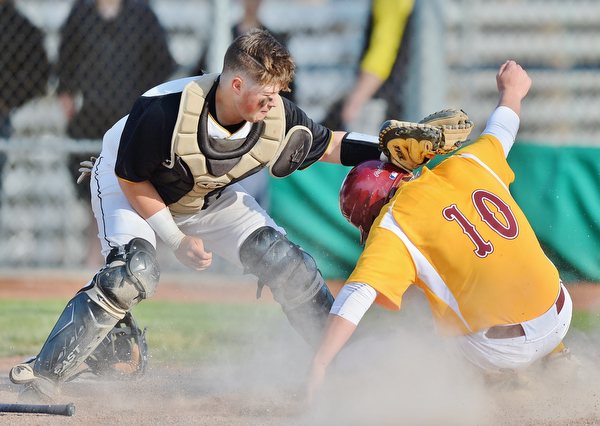 Jeff Lange | The Vindicator  MON, MAY 16, 2016 - Mooney baserunner Dom Pecchia (10) slides safely to home plate under the tag of Crestview catcher Jacob Wick (left) in the seventh inning of Monday's game at Cene Park.