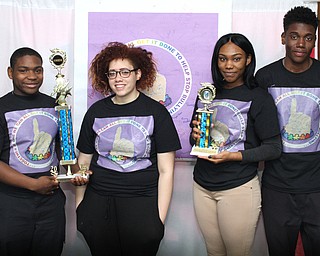 Nikos Frazier | The Youngstown Vindicator..(Left to Right) Members of the East High School Desitination Imagination Team; Devon Culver, Alexis Palumbo, Marvinia Fulks, and Malik Stoffer, pose with their trophies for a photo on Tuesday, May 17, 2016.