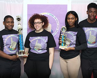 Nikos Frazier | The Youngstown Vindicator..(Left to Right) Members of the East High School Desitination Imagination Team; Devon Culver, Alexis Palumbo, Marvinia Fulks, and Malik Stoffer, pose with their trophies for a photo on Tuesday, May 17, 2016.