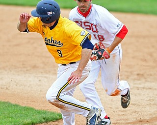 NILES, OHIO - MAY 17, 2016: Billy Salem #18 of YSU chases after Zarley Zalewski #9 of Kent State as he attempts to retreat to first base after being caught in a run down attempting to steal second base in the sixth inning of Tuesday afternoons game at Eastwood Field. YSU won 11-10 in eleven innings. DAVID DERMER | THE VINDICATOR