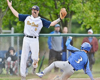Jeff Lange | The Vindicator  TUE, MAY 17, 2016 - McDonald third baseman Ben Carkido (9) looks on in disbelief as the catcher holds on to the ball allowing Jackson-Milton's Sebastian Lay (3) to easily steal third base in the bottom of the fifth inning of their DIV district semifinal at Bob Cene Park in Struthers.