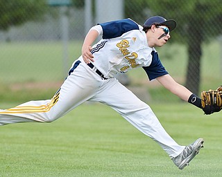 Jeff Lange | The Vindicator  TUE, MAY 17, 2016 - McDonald right fielder Nick Shiley stretches out in attempt to catch a ball sent to far right field in the bottom of the sixth inning of the Blue Devils' DIV district semifinal against Jackson-Milton at Bob Cene Park in Struthers.