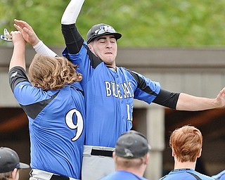 Jeff Lange | The Vindicator  TUE, MAY 17, 2016 - Jackson-Milton's Mike Assion (right) celebrates with Justin Rentz after defeating McDonald 12-2 to advance to the DIV district final against Western Reserve.
