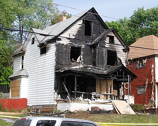   ROBERT K YOSAY | THE VINDICATOR.. Fire Chief John O'Neill says a preliminary investigation shows that the cause of a triple fatal fire late Tuesday on 1524 Bryson St. does not appear to be intentional. - ...--30-