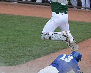 William D Lewis The vindicator Poland's13 don drummond  dives into home as Ursuline catcher Drew Polesta (3) leaps for the catch during 5-19 game at Cene.