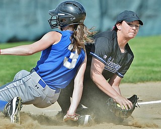Jeff Lange | The Vindicator  THU, MAY 19, 2016 - Hubbard base runner Mikayla Smith (3) slides safely into third as Lakeview third baseman Kylee Mann catches the throw from the outfield in the top of the first inning of Thursday's Division II district championship game at Alliance High School.